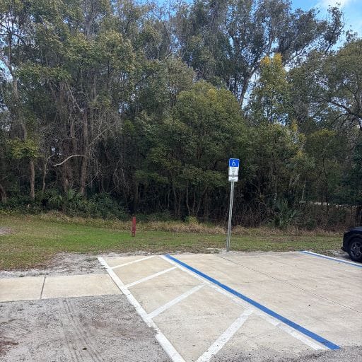 Parking area near the Colby Trail entrance at Colby-Alderman Park in Lake Helen, FL.